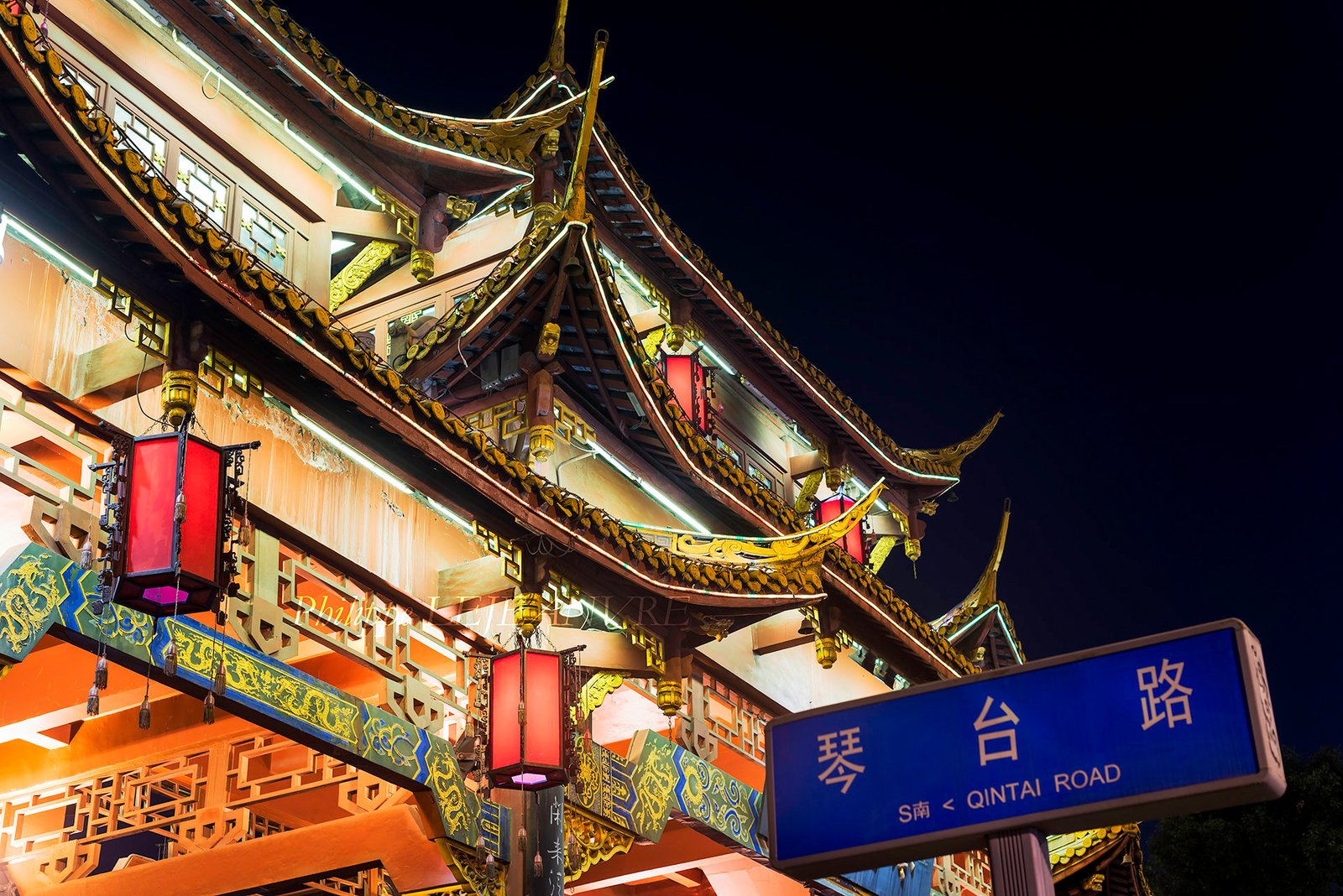 QinTaiLu gate illuminated at night in Chengdu, Sichuan province, China