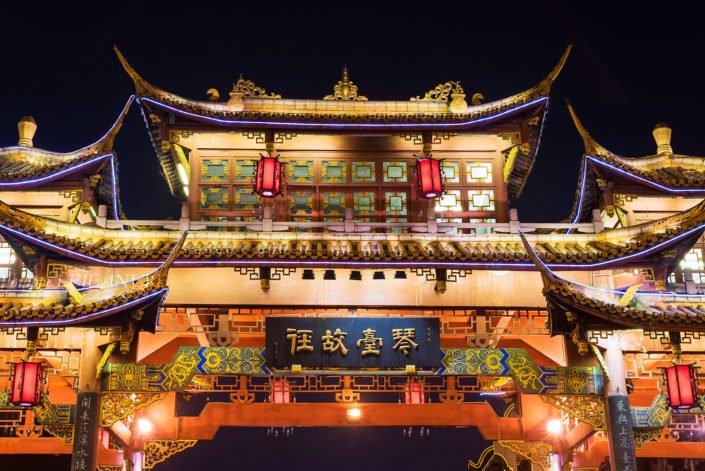 Qintailu chinese traditional gate illuminated at night closeup in Chengdu, Sichuan province, China