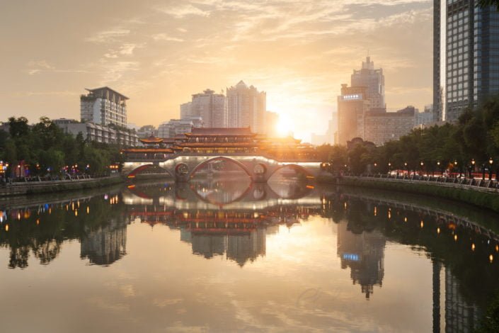 Anshun bridge reflecting in the Jinjiang river at sunset in Chengdu, Sichuan Province, China