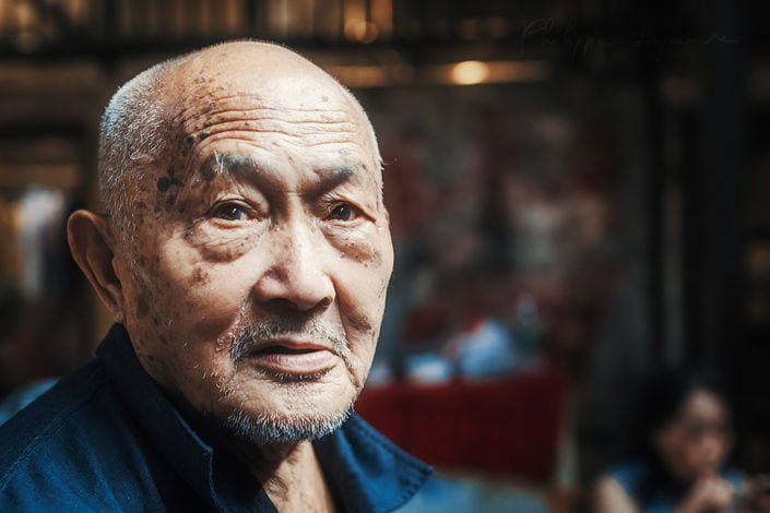 Portrait of an old chinese man in an ancient tearoom, Chengdu, Sichuan province, China