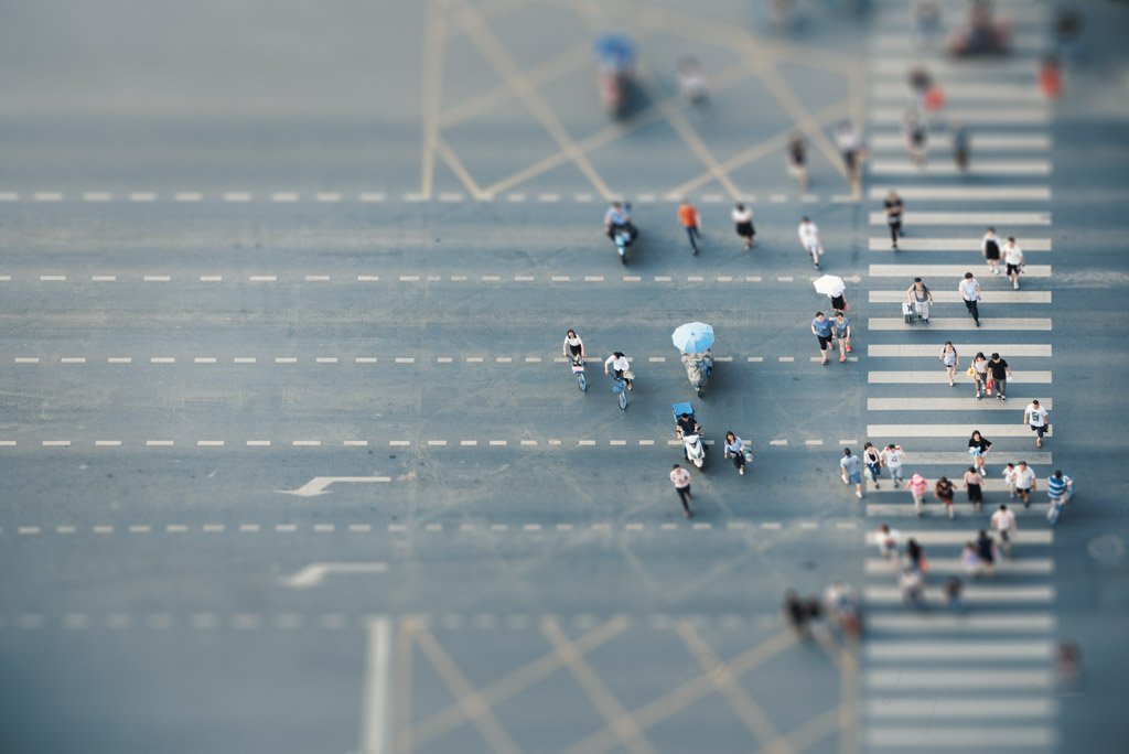 People crossing the road aerial view with tilt-shift effect in Chengdu, Sichuan province, China