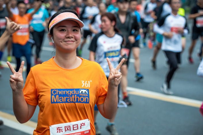 Chengdu, Sichuan province, China - Oct 27, 2019 : Young woman running at the Chengdu marathon