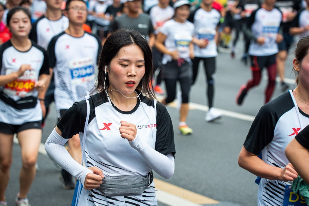 Chengdu, Sichuan province, China - Oct 27, 2019 : Young woman running at the Chengdu marathon