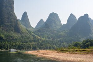 Li River cruise between Guilin and Yangshuo with limestone karst hills ...