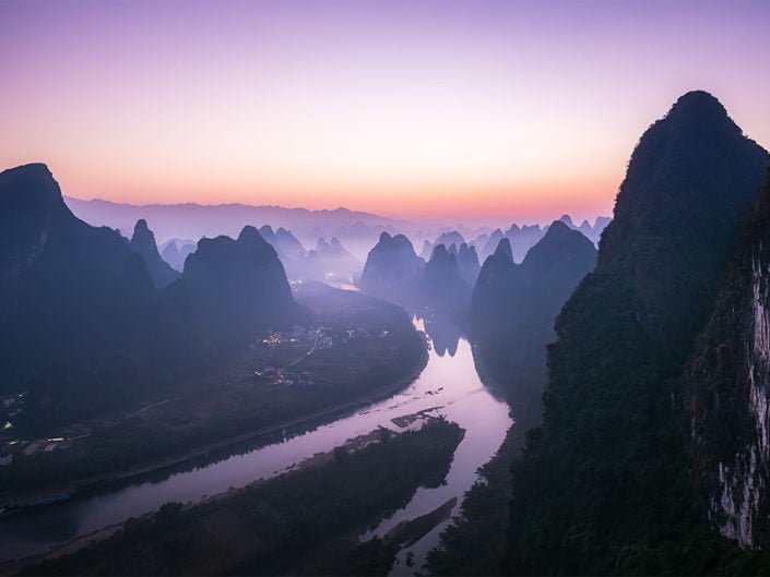 Mountain landscape in the mist at dawn with Li river in Xingping, Yangshuo, Guilin, Guangxi province, China