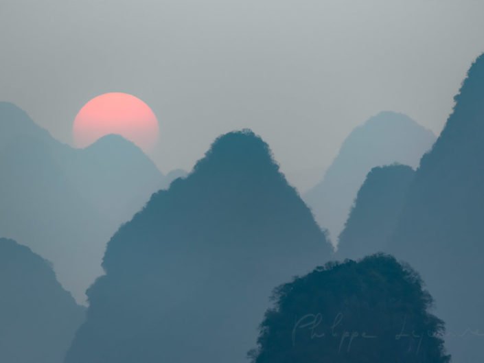 Sunrise behind mountains landscape in Xingping, Yangshuo, Guilin, Guangxi province, China
