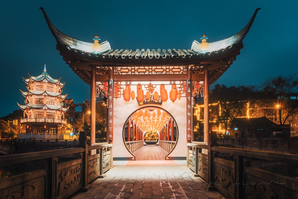 Baihuatan traditional chinese bridge illuminated at night in Chengdu, Sichuan province, China