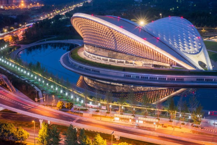 Chengdu open air music park modern building with futuristic architecture aerial view at blue hour, Sichuan province, China