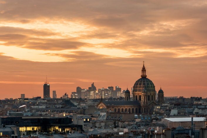 La Defense financial district and Saint-Augustin Church at sunset in Paris, France