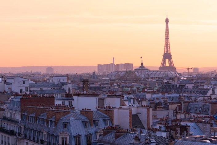 Paris skyline with Eiffel tower aerial view at sunset - purple colors, France