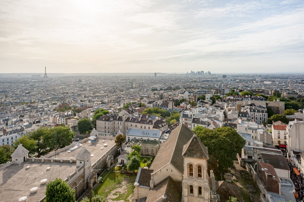 Paris with Eiffel tower and la Defense Financial district aerial view from Montmartre, France