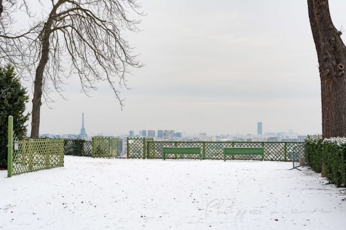 Paris under the snow from a high point of view in the Parc de Saint-Cloud, France