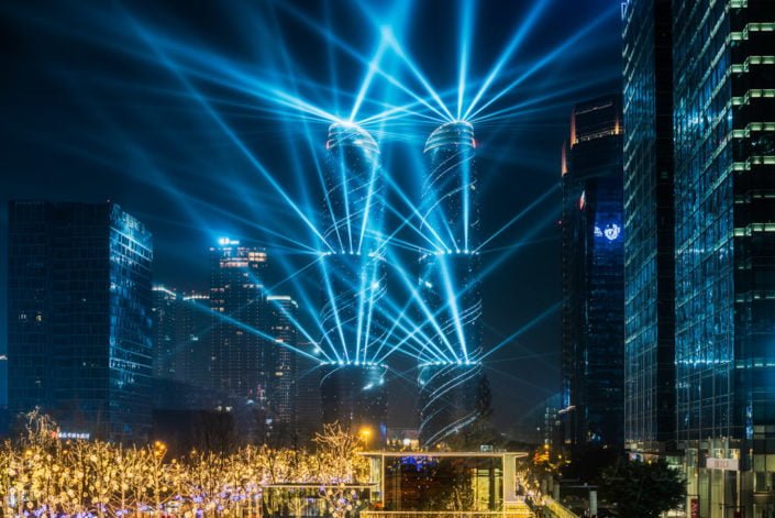 Chengdu, Sichuan province, China : Jiaozi Financial street twin towers lightshow at night in the business district of the city.