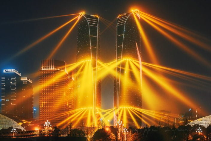 Chengdu, Sichuan province, China : Jiaozi Financial street twin towers lightshow at night in the business district of the city.