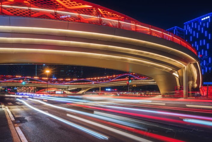 Car traffic light trails at night at Jiaozi ring bridge in Chengdu, Sichuan province, China