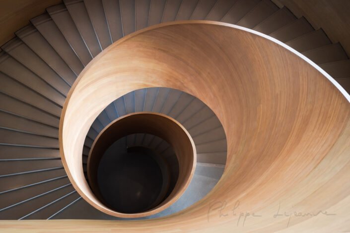 Spiral wood staircase high angle view with natural light