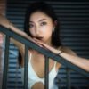 Young woman in a staircase close-up portrait in summer, Chengdu, Sichuan province, China