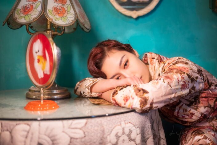 Young woman sitting by a table vintage portrait, Chengdu, Sichuan province, China