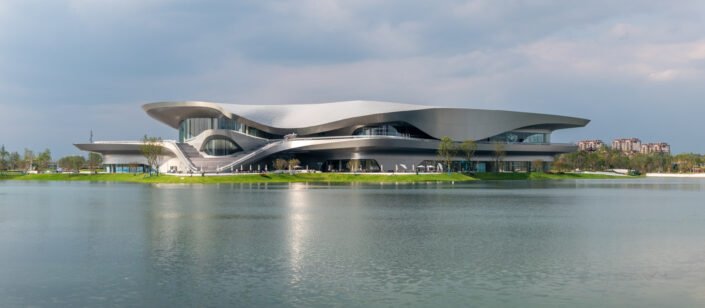 Chengdu, Sichuan province, China - Oct 27, 2023 : Science-fiction museum reflecting in a lake in ShiJie KeHuan park panorama