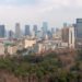 Chengdu, Sichuan province, China : City downtown skyline aerial view with people's park in the foreground