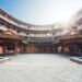 Luodai, Sichuan Province, China : Hakka traditional round house with sunrays above the roof.